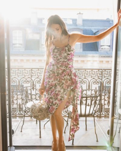 Nina Dobrev floral dress featuring a soft white background