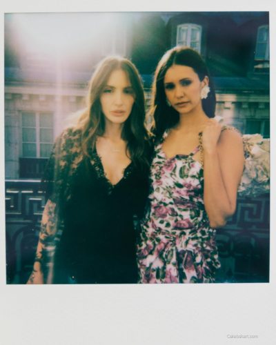 Nina Dobrev floral dress complemented by a flower handbag