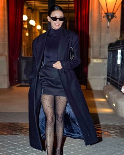 Nina Dobrev chic black turtleneck and stylish mini skirt