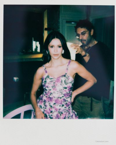 Nina Dobrev black dress featuring a classic silhouette and gold accents