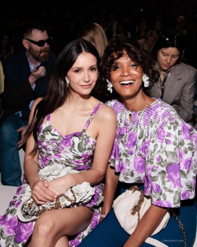 Nina Dobrev black dress with soft fabric and luxurious gold necklace