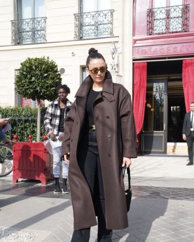 Nina Dobrev stylish sunglasses and chic black bag