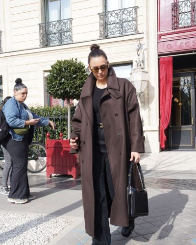 Nina Dobrev black fitted top and high-waisted black jeans