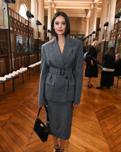 Nina Dobrev gray pencil skirt representing versatile fashion choice