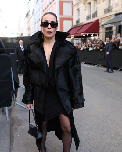 Noomi Rapace minimalist black handbag adding sophistication