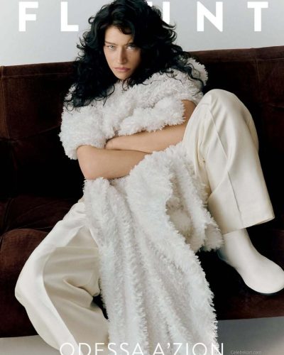 Odessa A’zion wearing wide-leg trousers in soft beige.