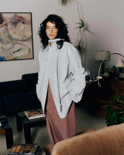 Odessa A’zion accessorizes with oversized glasses and neutral tones.