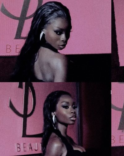 Olandria in a bold red dress with elegant silhouette