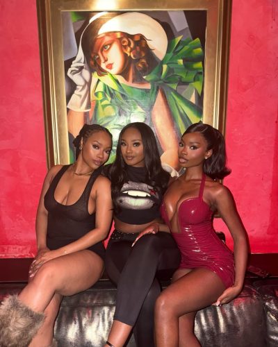 Olandria in a vibrant red dress with flattering cut