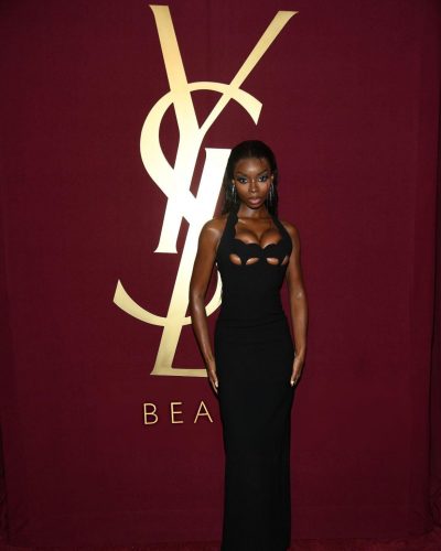 Olandria in elegant black dress with silver drop earrings