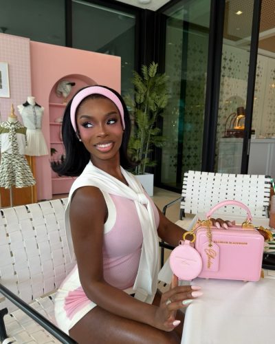 Olandria in pink top