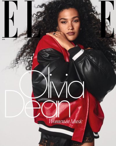 Olivia Dean wearing a vibrant red gown with shimmering sequins