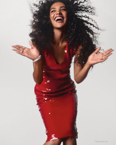 Olivia Dean in elegant red dress paired with silver jewelry