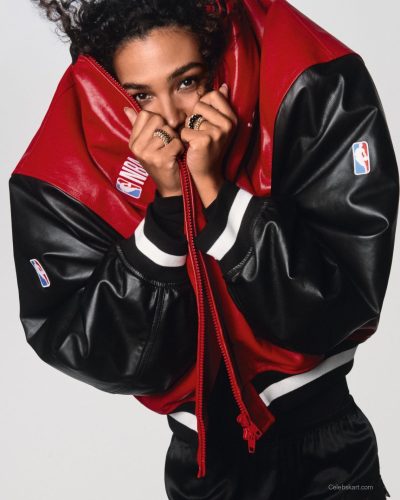 Olivia Dean in a fiery red dress with natural makeup