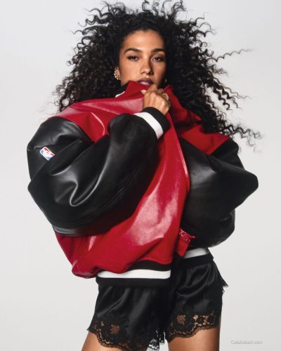 Olivia Dean in a glamorous red dress with a fitted design