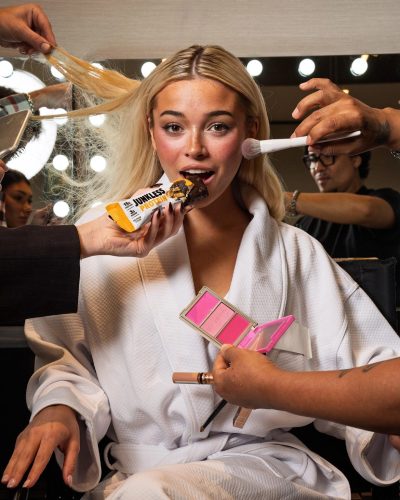 Olivia Dunne in a chic white robe with health-focused snack