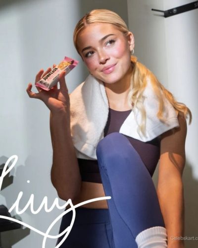 Olivia Dunne wearing a white robe youthful spirit