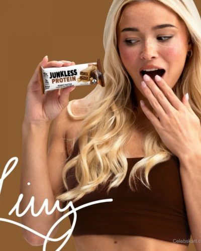 Olivia Dunne wearing a chic white robe with soft waves hairstyle