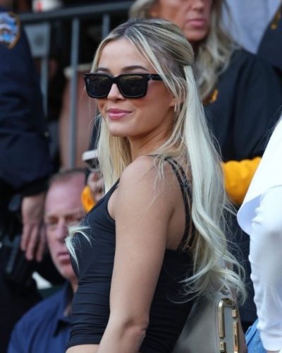 Olivia Dunne in fitted black top and relaxed blue jeans