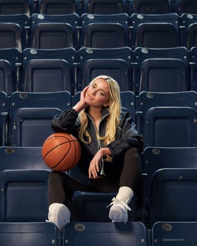 Olivia Dunne cream tracksuit and trendy high-top sneakers