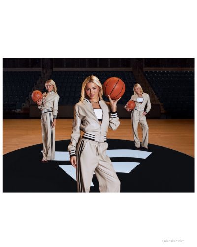 Olivia Dunne playful expression in cream tracksuit outfit