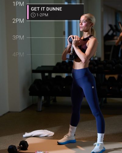 Olivia Dunne in black crop top and sleek leggings ensemble.