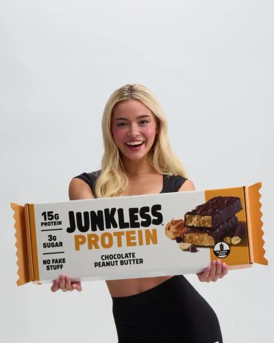 Olivia Dunne in black athletic crop top and high-waisted leggings.