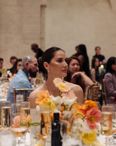 Olivia Munn black dress featuring a deep neckline and minimalist design