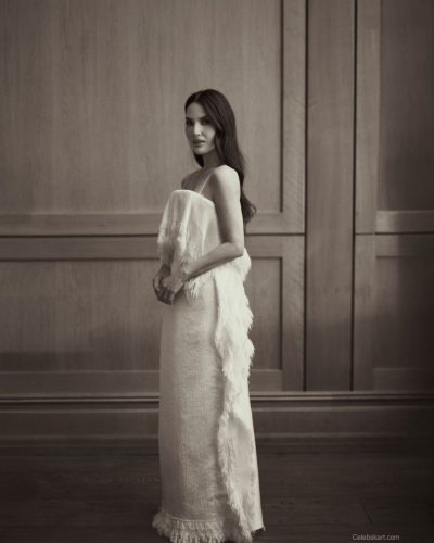 Olivia Munn in a white dress complemented by minimalist accessories