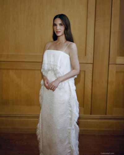Olivia Munn wearing a chic white dress with a modern silhouette