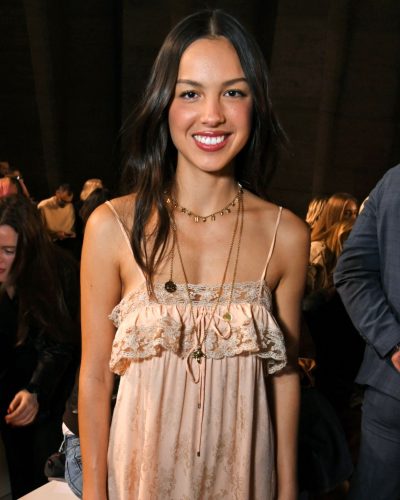 Olivia Rodrigo soft waves hairstyle with bright smile