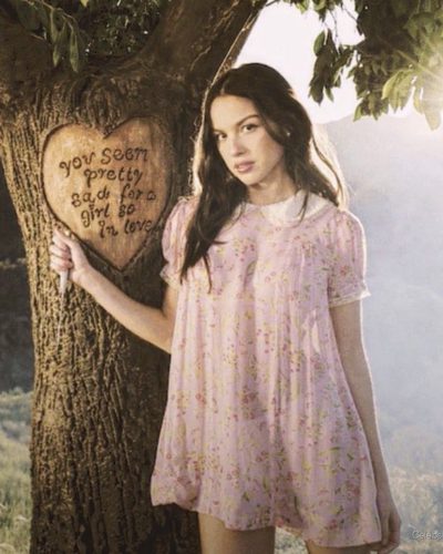 Olivia Rodrigo light pink dress adorned with subtle designs and textures