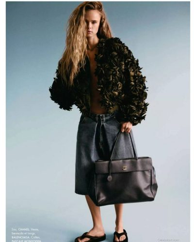 Olivia Vinten in brown oversized jacket and chic top