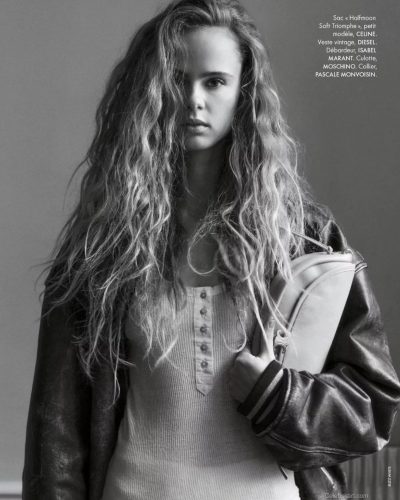 Olivia Vinten in chic brown jacket and fashionable handbag