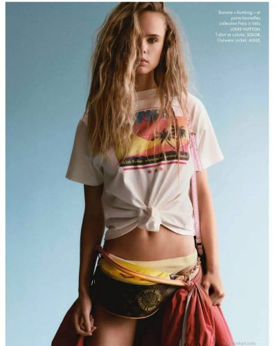 Olivia Vinten in stylish brown jacket and trendy boots