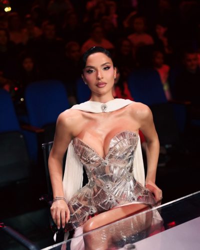 Oriola Marashi wearing chic structured gown with soft drape