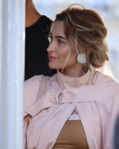 Paris Jackson stylish pink jacket over gold top