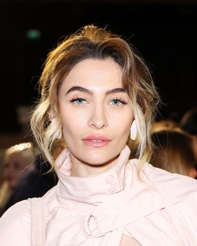 Paris Jackson relaxed smile with pink and gold attire