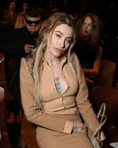 Paris Jackson modern twist on classic tan fitted dress