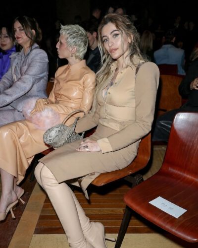 Paris Jackson fitted dress accentuating figure in rich tan