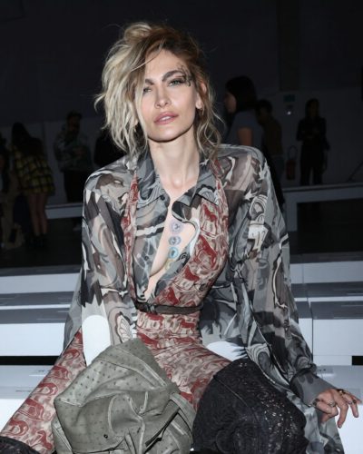 Paris Jackson sheer top layered over jumpsuit in red and gray