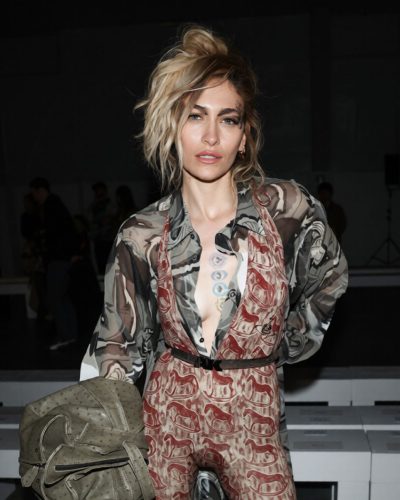 Paris Jackson fashionable green jacket over eye-catching jumpsuit