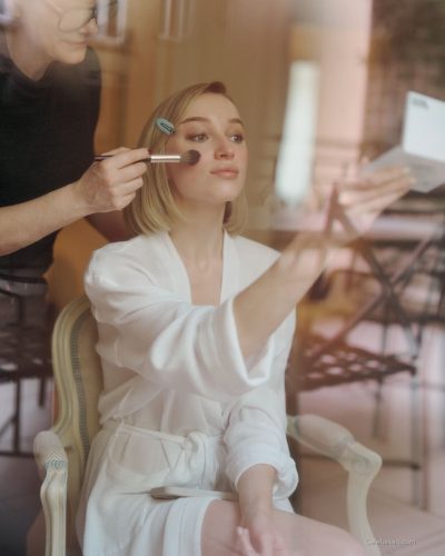 Phoebe Dynevor stylish black trousers with delicate white top