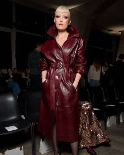 Pom Klementieff in tailored burgundy coat and chic black heels
