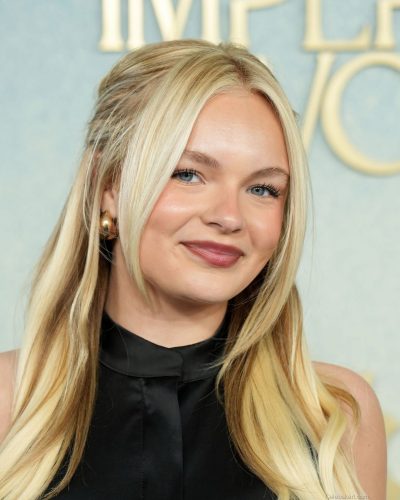 Pressley Hoshbach in black sleeveless top and zebra-striped skirt.