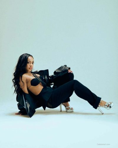 Priah Ferguson in pastel skirt and textured lace top combination.