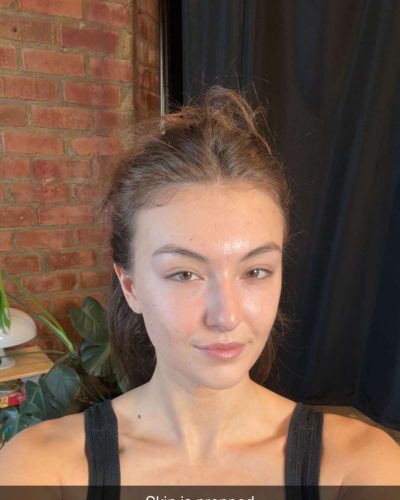 Rachel Pizzolato black tank top with bright clear complexion