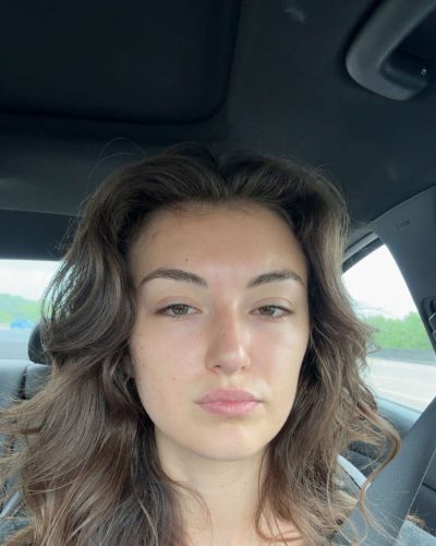 Rachel Pizzolato red dress with a chic neckline design