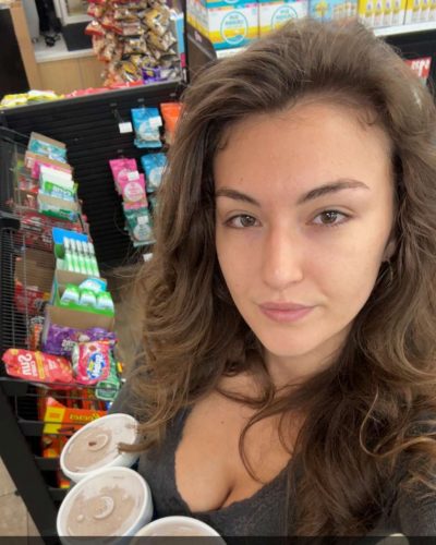 Rachel Pizzolato red dress against a bright backdrop