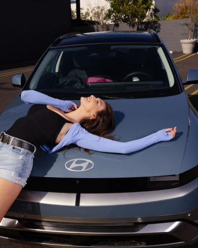 Rachel Pizzolato red dress accentuated with a stylish belt